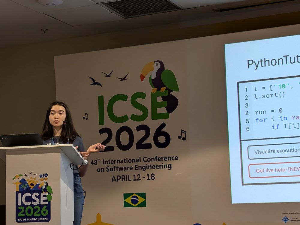 Emma Shedden speaking at a podium in front of an ICSE 2026 backdrop, next to a slide about PythonTutor.